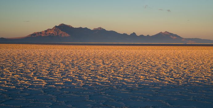 The Bonneville Salt Flats is a densely packed salt pan in Tooele County in northwestern Utah. The area is a remnant of the Pleistocene Lake Bonneville and is the largest of many salt flats located west of the Great Salt Lake.