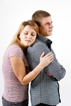 young woman hugging man from the back