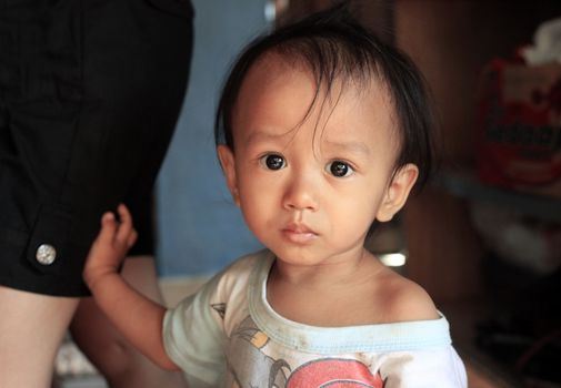 Portrait of the little asian boy. Indonesia, Bali