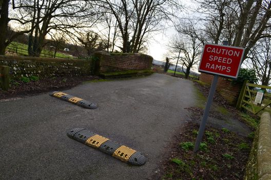 Notice informing road users of traffic speed ramps on the road to slow speed of vehicals.