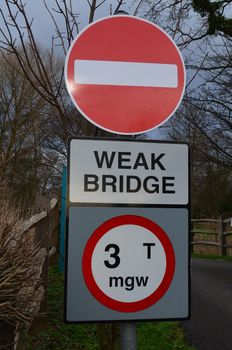 Weak bridge road sign warning traffic road users of weight limit that is permitted to cross.