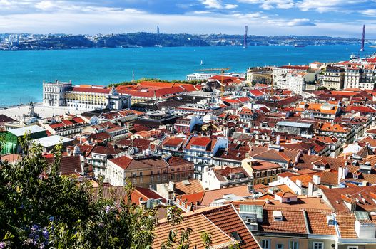 Bird view of central Lisbon with colorful houses and orange roofs