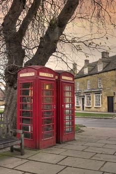 Phone boxes in the popular Cotswold village of Broadway, Worcestershire, England.