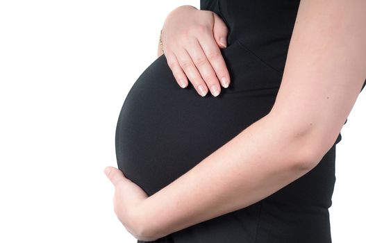 Shot of pregnant woman's belly in black dress