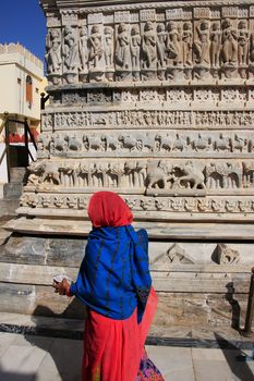 Indian woman walking around Jagdish temple, Udaipur, Rajasthan, India