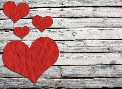 Paper hearts on a wooden surface. The concept of Valentine's Day