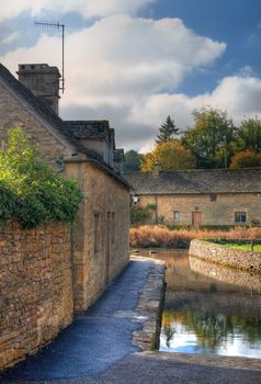 The mill race at Lower Slaughter near Bourton on the Water, Gloucestershire, England.