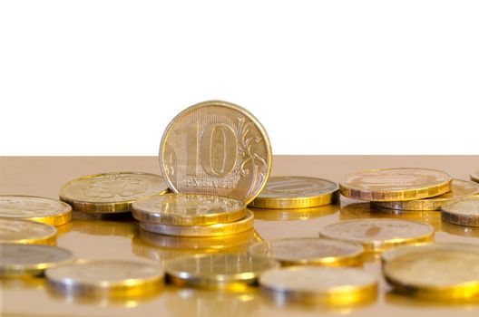 Ten-rouble coins on Golden surface with white background