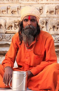 Indian man sitting at Jagdish temple, Udaipur, Rajasthan, India