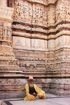 Indian man sitting at Jagdish temple, Udaipur, Rajasthan, India