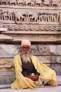 Indian man sitting at Jagdish temple, Udaipur, Rajasthan, India