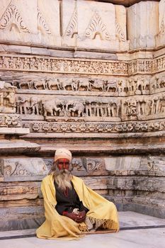 Indian man sitting at Jagdish temple, Udaipur, Rajasthan, India