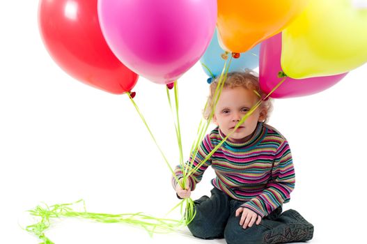 Shot of little cute girl with multicolored air balloons isolated on white