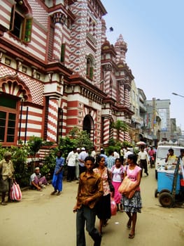 People walking on a street of Pettah neighborhood, Colombo, Sri Lanka