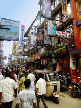 People walking on a street of Pettah neighborhood, Colombo, Sri Lanka