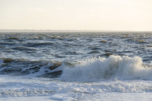 Waves on the North Sea in Germany on a windy day as seen from the beach
