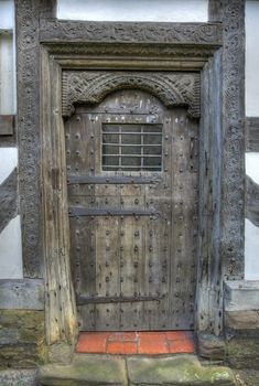 Carved Tudor door, Ludlow, Shropshire, England.