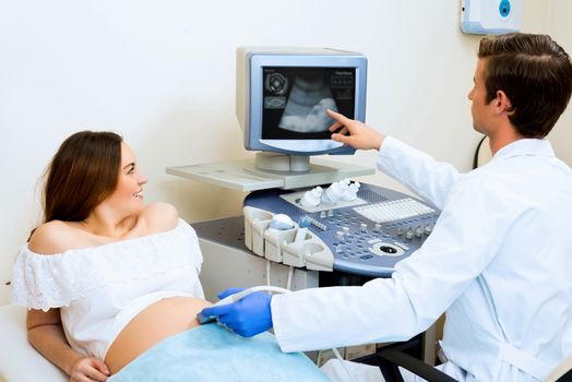 young pregnant woman on the ultrasound, health check