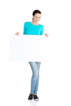 Portrait young happy woman with blank board , isolated on white