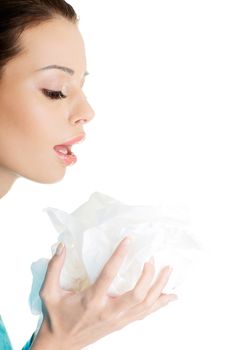 Young woman with tissue - sneezing , isolated on white