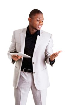 Handsome businessman working on tablet computer. Isolated on white.