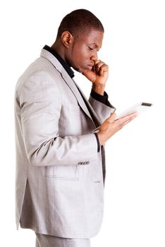 Handsome businessman working on tablet computer. Isolated on white.