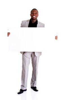 Happy successful businessman holding and showing blank advertisement. Isolated on white.