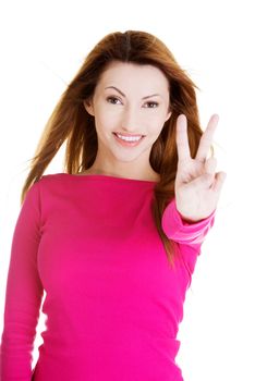 Happy woman showing victory sign