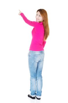 Happy , excited woman pointing on copy space, isolated on white