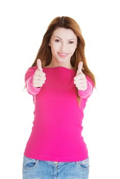 Beautiful woman in casual clothes gesturing thumbs up.