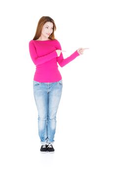 Happy , excited woman pointing on copy space, isolated on white