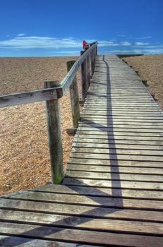 Wooden boardwalk over Chesil Beach, Dorset, England.