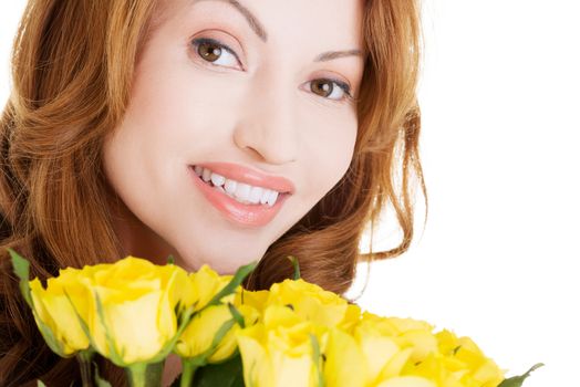 Happy woman with fresh yellow roses.