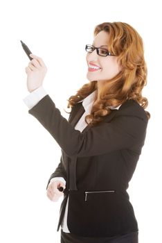 Businesswoman with a marker, isolated on white background