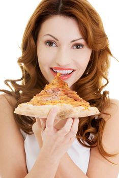 Happy woman eating pizza. Over white background.