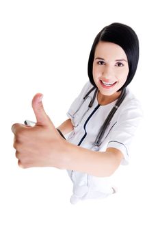 Young female doctor or nurse gesturing OK , isolated