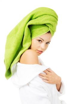 Beautiful woman with a towel on her head, isolated on white