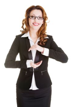 Happy business woman showing copy space on her palm, isolated on white