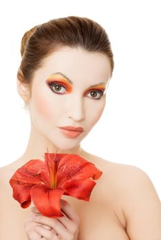 Beautiful woman with a red lily, isolated on white