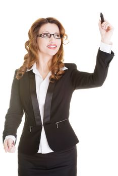 Businesswoman with a marker, isolated on white background