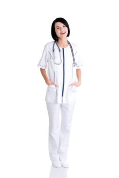 Nurse or young doctor standing smiling. Isolated on white background. Full body