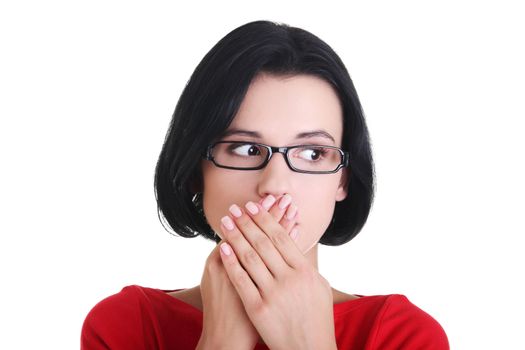 Shocked woman covering her mouth with hands, isolated on white