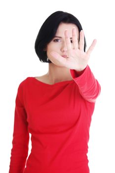 Confident woman making stop gesture sing with hand