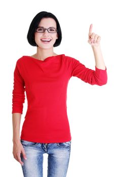 Happy , excited young woman pointing on copy space, isolated on white