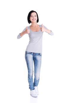 Beautiful young woman in casual clothes gesturing thumbs up.