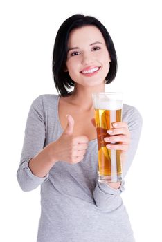 Beautiful and sexy young woman with glass of beer gesturing thumbs up, isolated on white