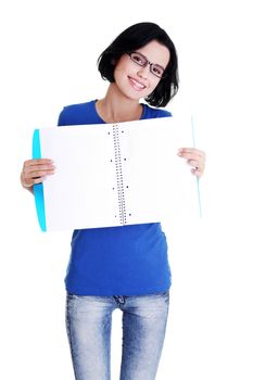 Studying happy young woman showing blank pages of her notebook for school.