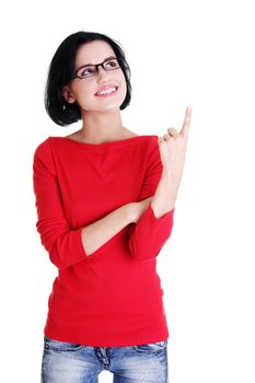 Happy , excited young woman pointing on copy space, isolated on white