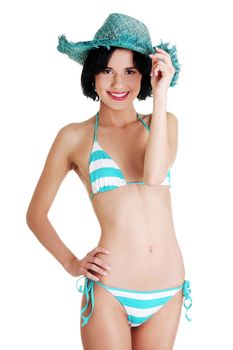 Sexy brunette woman posing in bikini, over white background