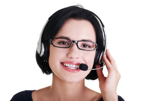 Closeup of attractive customer support representative smiling with headset on white background